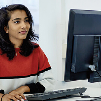 student with computer