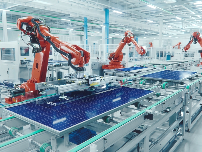 Industrial robots assembling solar panels