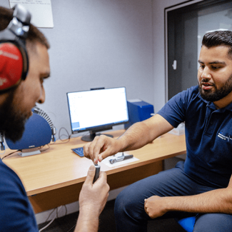 Audiology student conducting a hearing test